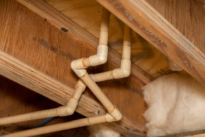 image of pvc pipes under home